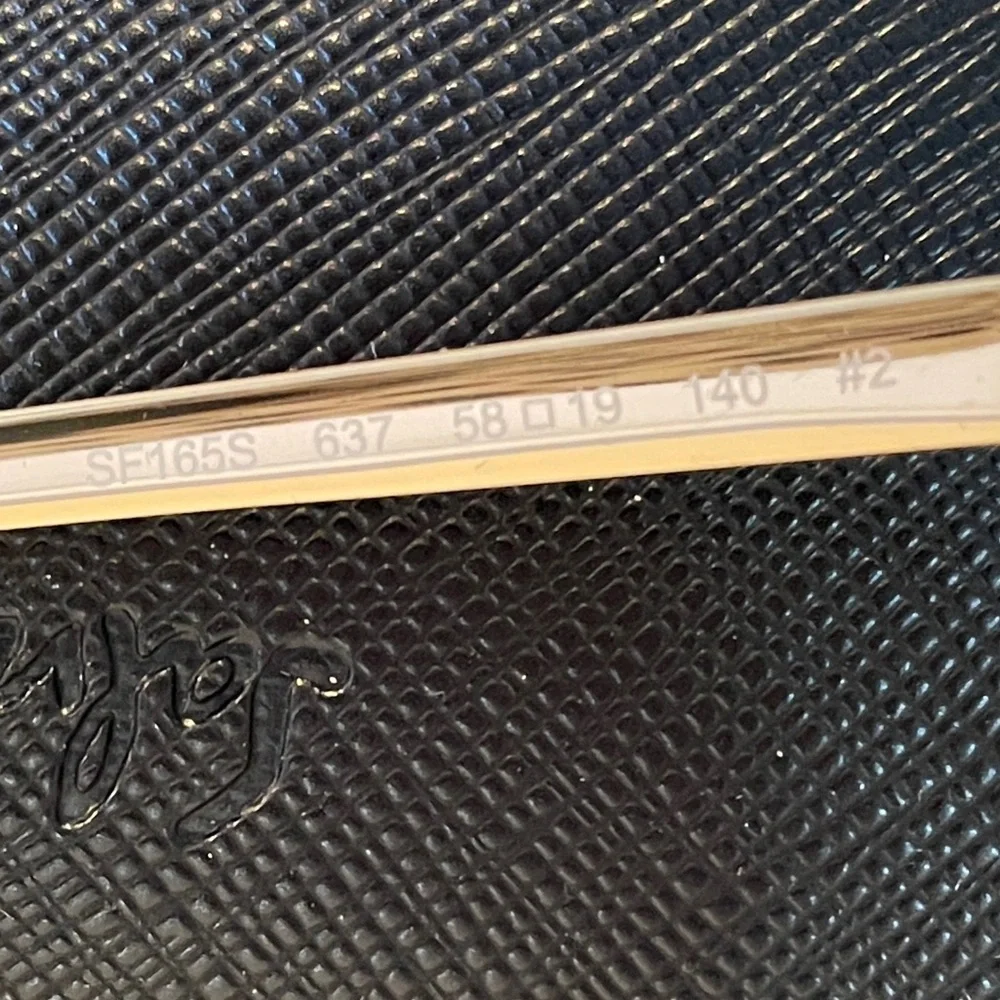 Salvatore Ferragamo sunglasses, new in box with case and cleaning cloth.